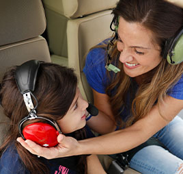 Photo of mom and daughter on plane. Link to Gifts of Appreciated Securities.